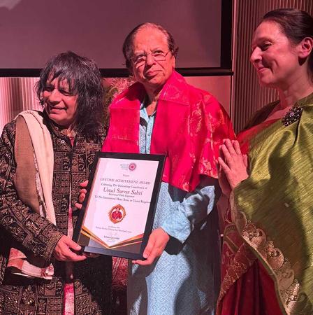 Legendary Tabla Maestro Ustad Tari Khansahb And Sahana Gero MBE Artistic Director Of World Heart Beat Music Academy, London Presented The Award To Ustad Sarvar Sabri